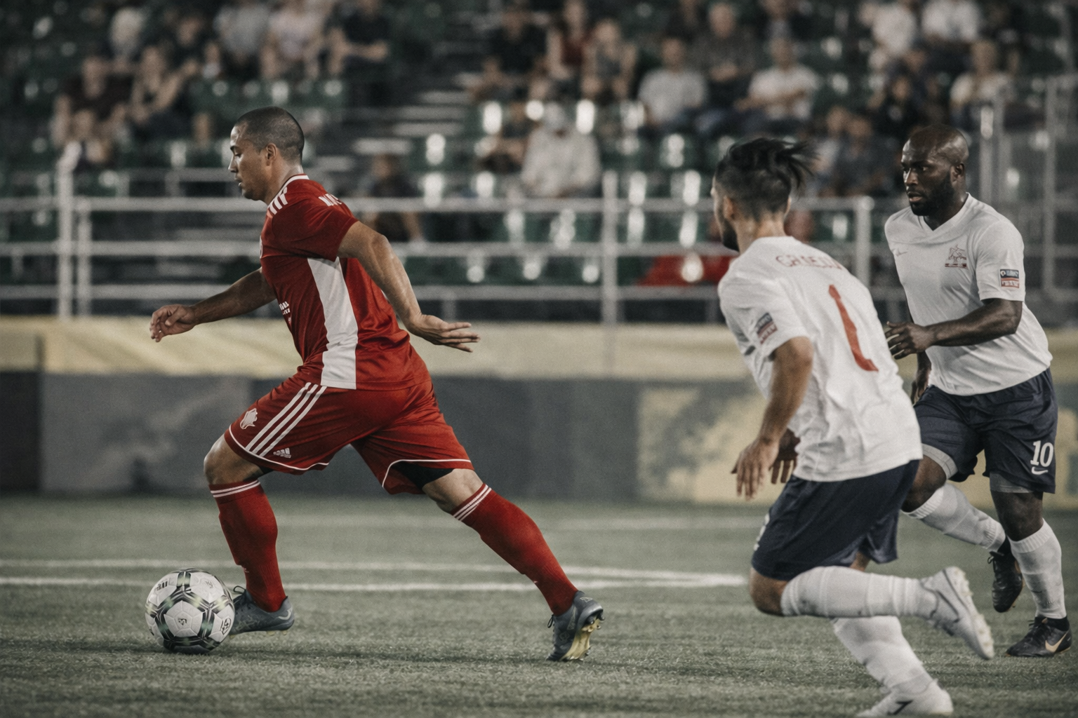 Noel Castillo competing in professional soccer match demonstrating speed and ball control under pressure